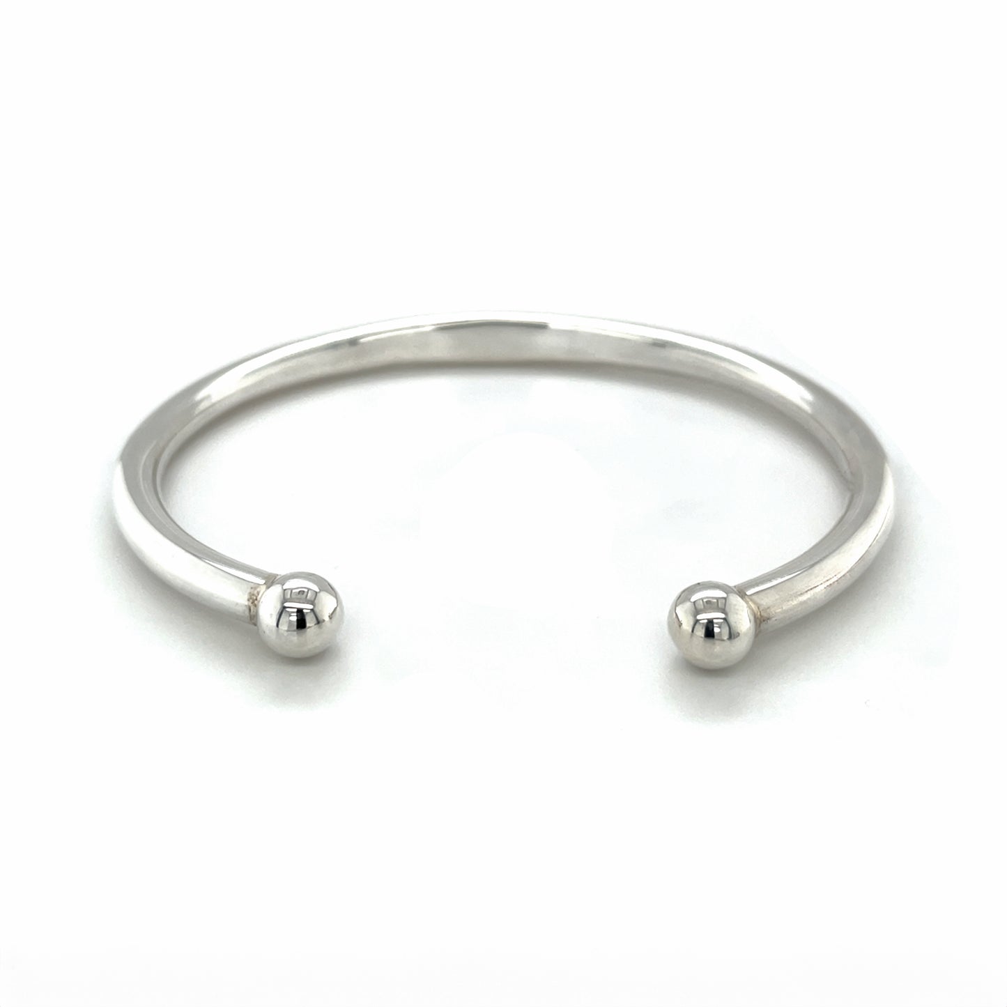Silver torq bangle set with 2x emeralds