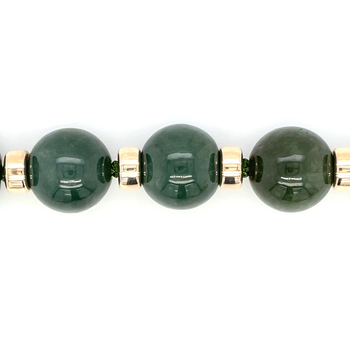 A custom jade neaclace, 13.5mm (approx) natural A grade jade beads with 9ct gold spacers and bolt-ring clasp.