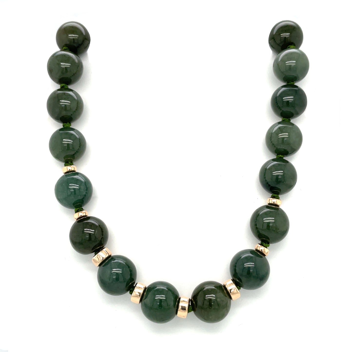 A custom jade neaclace, 13.5mm (approx) natural A grade jade beads with 9ct gold spacers and bolt-ring clasp.