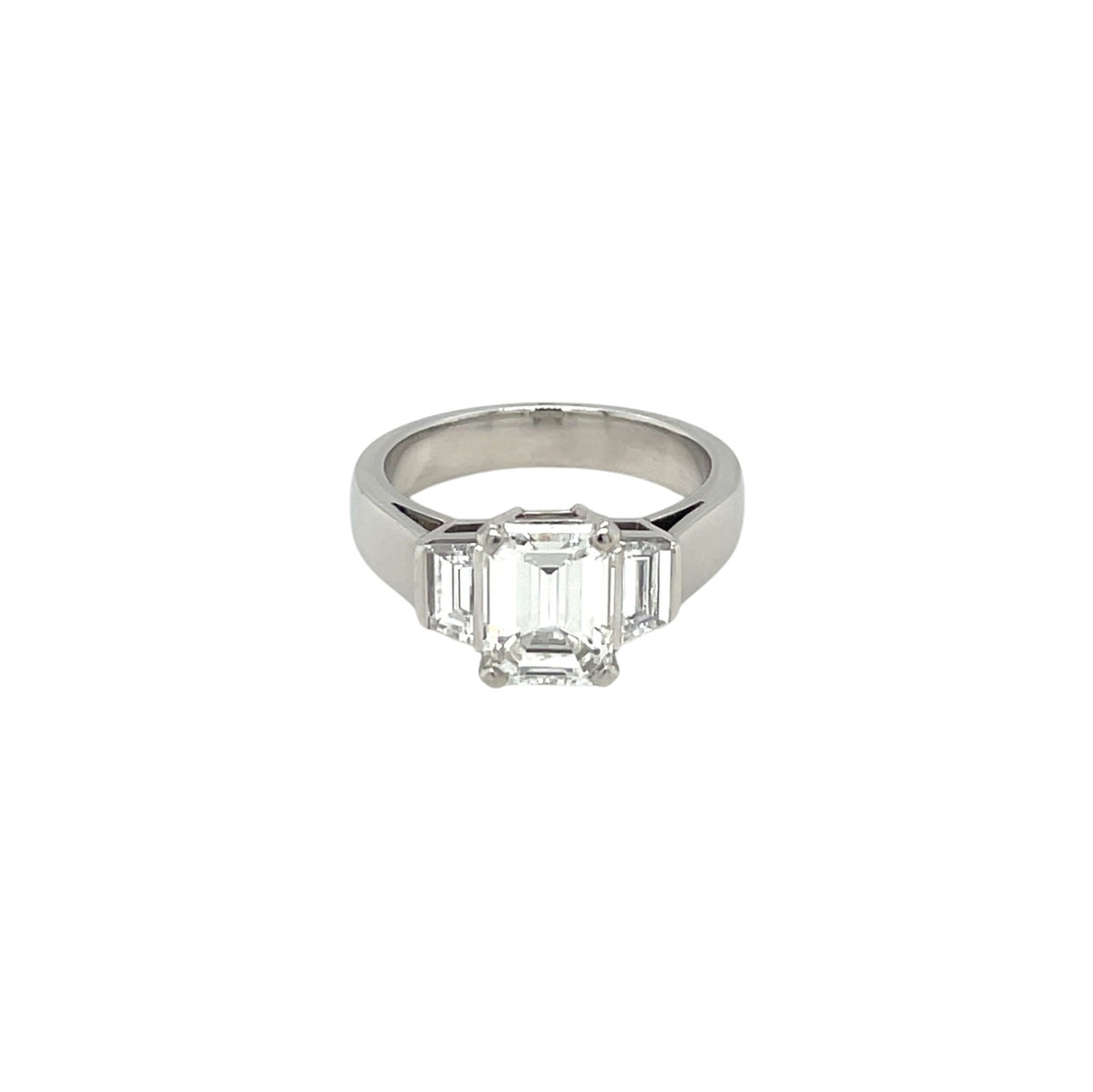 Platinum Emerald-Cut Diamond Three Stone Ring (K)